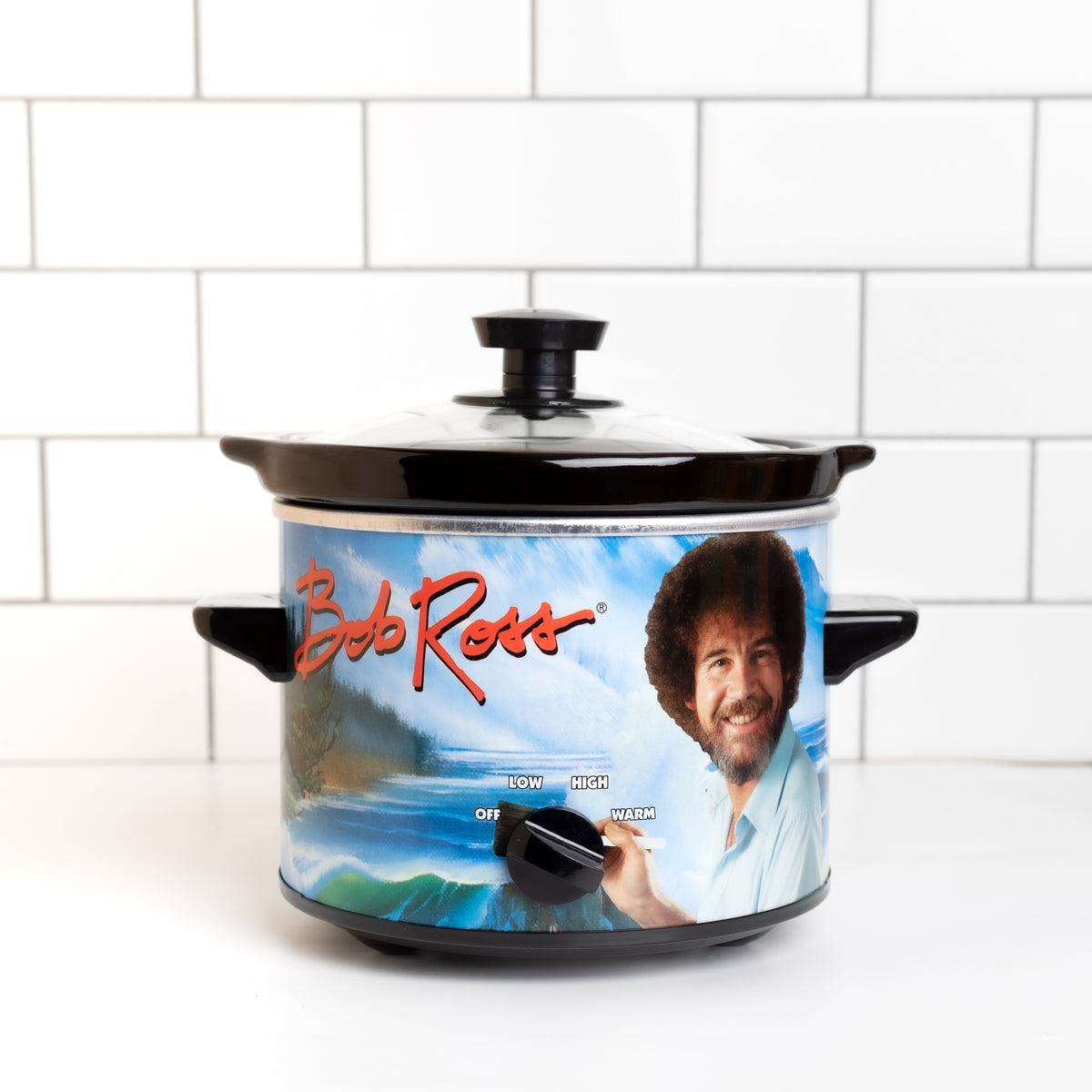 Bob Ross slow cooker on counter with white subway tiles